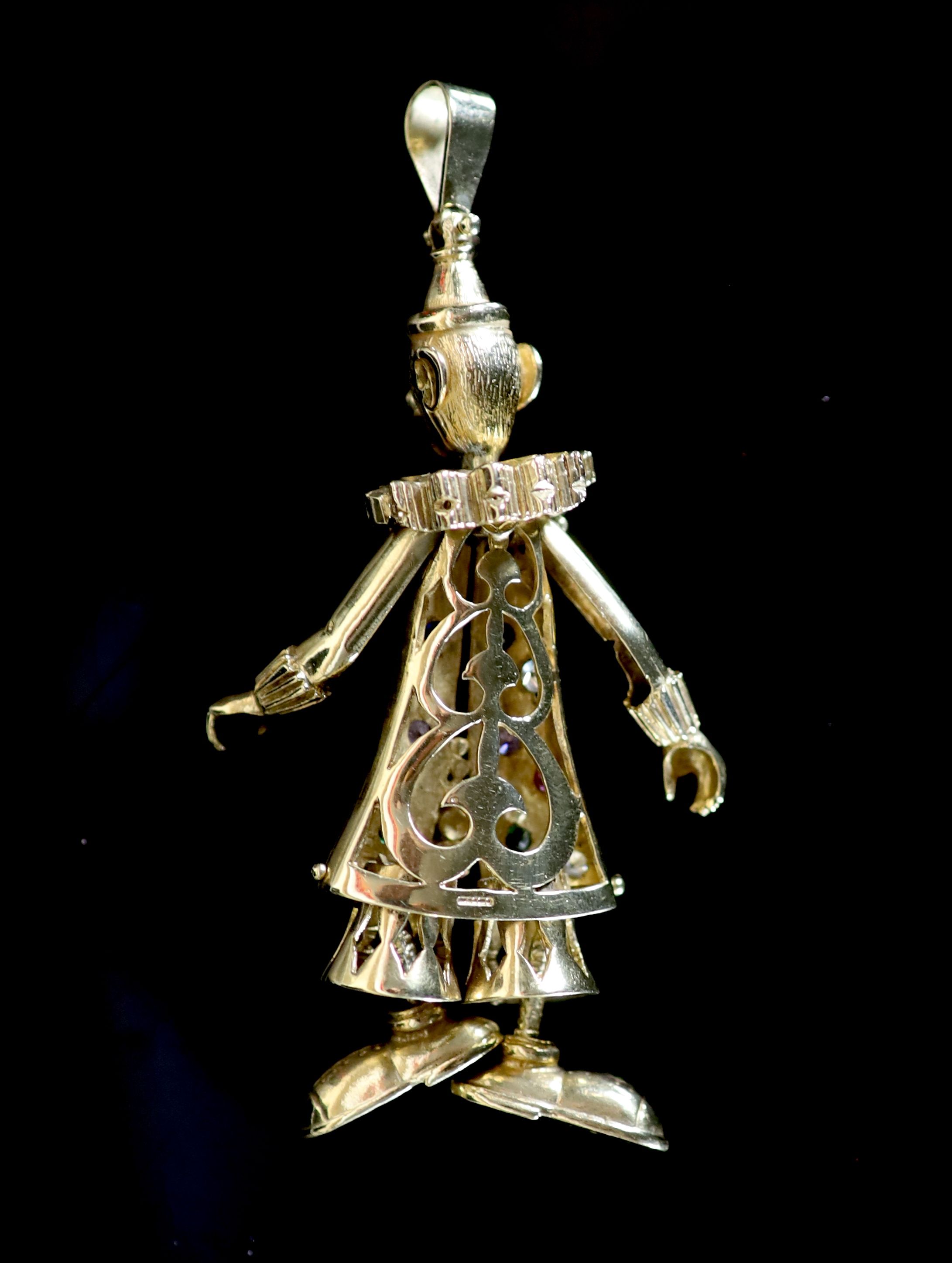 A modern 9ct gold and gem set articulated pendant, modelled as a clown